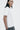 Unfeigned white basic t-shirt side top on model lifestyle half body studio