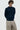 Unfeigned navy cashmere knit front on model worn half body studio