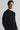 Unfeigned black crewneck merino knit on model portrait