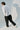 Unfeigned white long sleeve oversized t-shirt on model full body studio