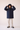Unfeigned dark navy mini puffed coat WR detail front on model worn studio logo