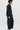 Unfeigned black technical blazer N WR side on model full body studio