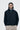 Unfeigned dark navy technical coach jacket WP on model half body studio