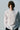 Unfeigned white basic long sleeve t-shirt on model half body studio