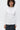Unfeigned white basic long sleeve t-shirt with logo on model half body studio