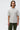 Unfeigned grey melange basic t-shirt with logo on model half body studio