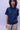 Unfeigned navy blue basic t-shirt with logo on model half body studio