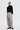 Unfeigned black her merino polo on model full body studio