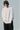 Unfeigned white long sleeve oversized t-shirt on model half body studio