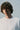Unfeigned white long sleeve oversized t-shirt on model portrait studio