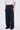 Unfeigned black technical city pants N WR side 3/4 worn on model studio